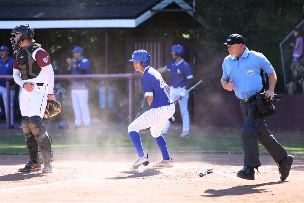 St. Francis Catholic's Andy Janelle (27) scores in the bottom of the first ining to tie the contest 1-1 against Oak Hall in the Class 1A-District 5 championship game. Photo by C.J. Gish