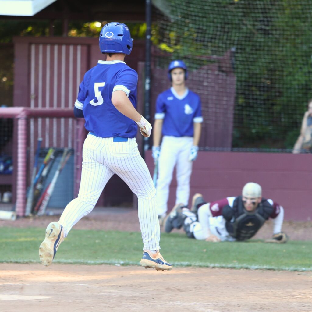 St. Francis Catholic's Nate Muir scores the game-tying run in the bottom of the seventh inning against Oak Hall in the Class 1A-District 5 championship game. Photo by C.J. Gish