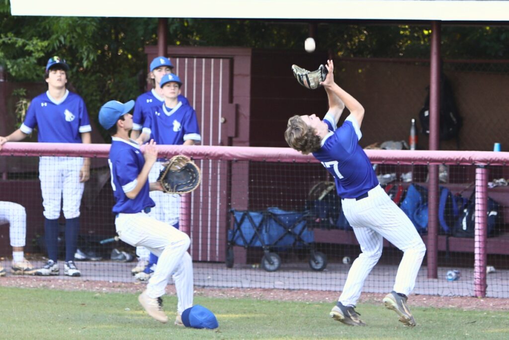 St. Francis Catholic's Sander Williams catches a seventh-inning pop-up for an out against Oak Hall in the Class 1A-District 5 championship game. Photo by C.J. Gish