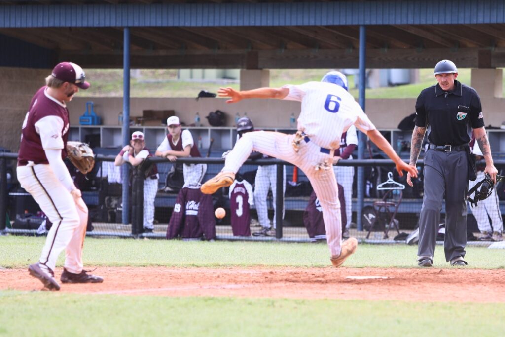 St. Francis Catholic's Sawyer Williams scores on a passed ball in the third inning against Oak Hall in game two of the 1A Regional quarterfinals. Photo by C.J. Gish