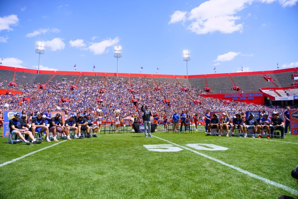 The Florida men's basketball team on the field at the Orange and Blue spring football game. Photo by Tim Rodriquez