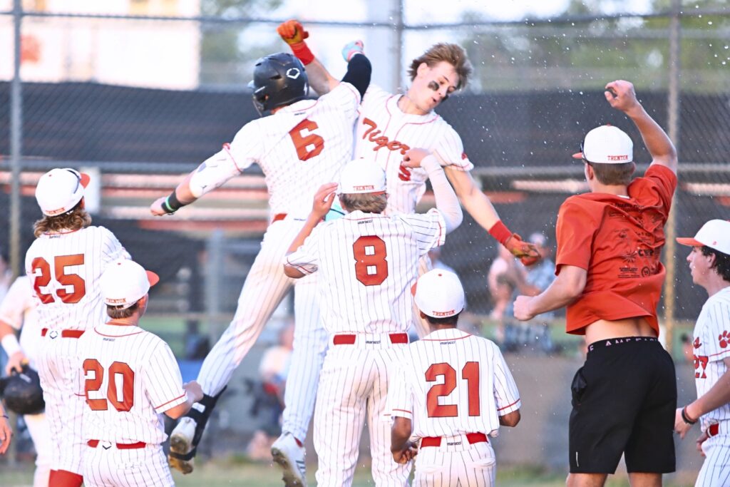 Trenton's Ty Moses (5) celebrates with his teammates after hitting a three-run home run in the third inning against Chiefland in game two of the Rural Region 4 Semifinals. Photo by C.J. Gish