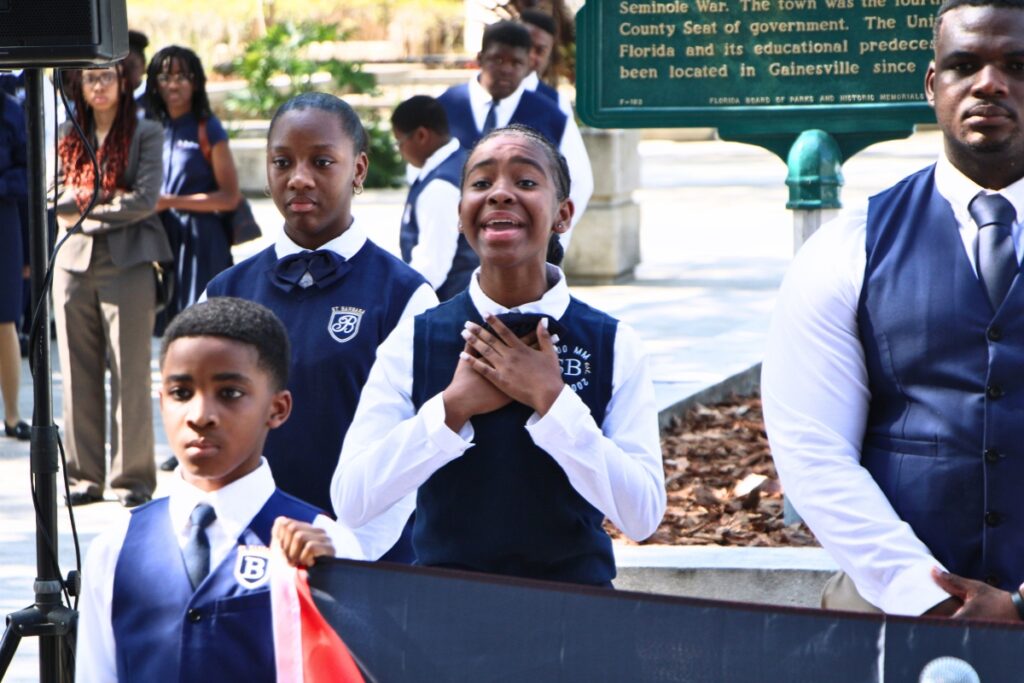 A Saint Barbara Leadership Institute student performs at Juneteenth flag raising. Photo by Lillian Hamman