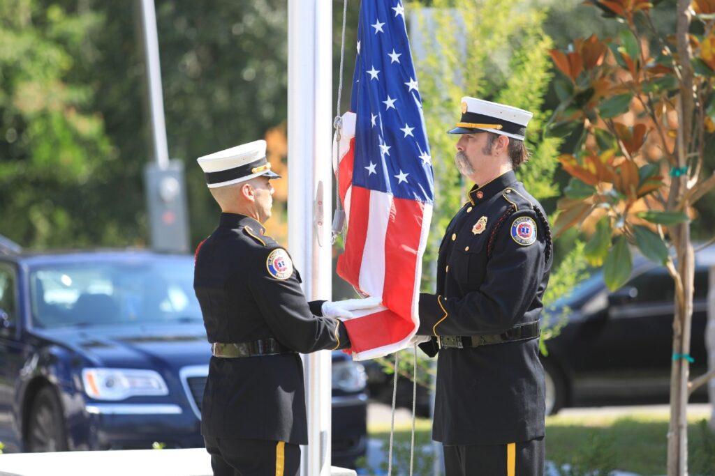 Alachua County Fire Rescue staff raise the American flag for the first time at the new station. 