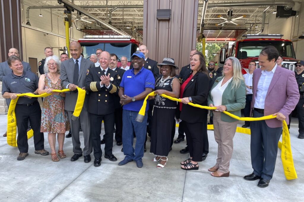 Alachua County and city of Alachua officials mark the opening of Fire Station 21 with a decoupling ceremony. 