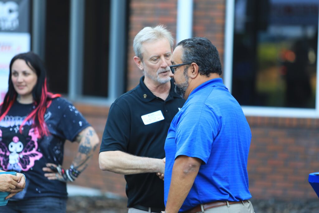 An attendee wins Gator tickets at Mainstreet's 5-year anniversary. Photo by Seth Johnson