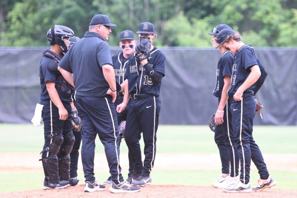 Buchholz coach Ron Brooks talks to the Bobcats infield and pitcher Cohen Laflet during the fourth inning against Pace in game two of the 6A Region 1 Final. Photo by C.J. Gish