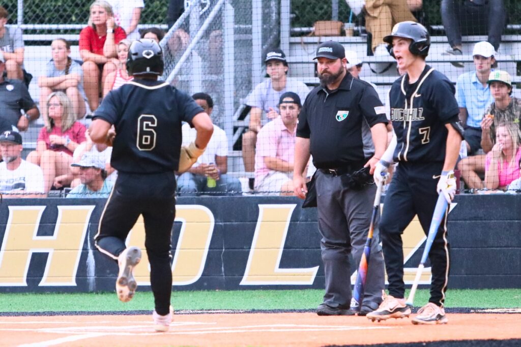 Buchholz's Justin Williams (6) scores the first run in the first inning against Tate (Cantonment) in game two of the 6A Region 1 Semifinals. Photo by C.J. Gish