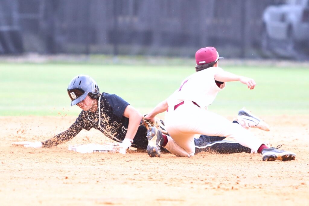 Buchholz's Zac Brown (4) with a second-inning stolen base against Tate (Contonment) in game two of the 6A Region 1 Semifinals. Photo by C.J. Gish