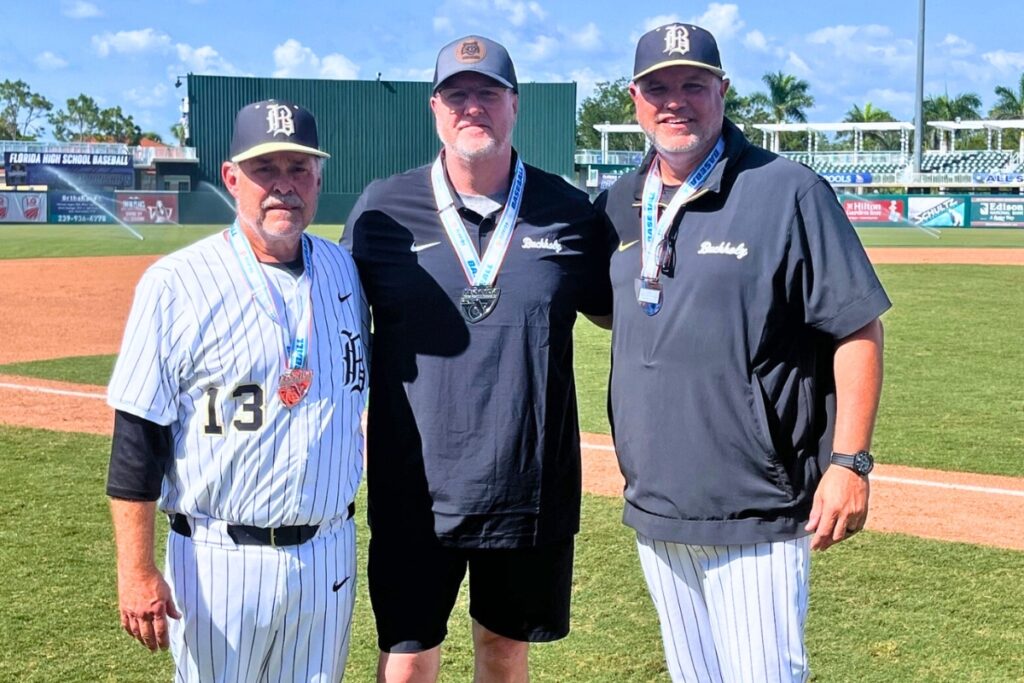 (From left) Buchholz's assistant coach Greg Norman, principal Kevin Purvis and head coach Ron Brooks after the 6A state championship game on Saturday. Photo by Mike Ridaught