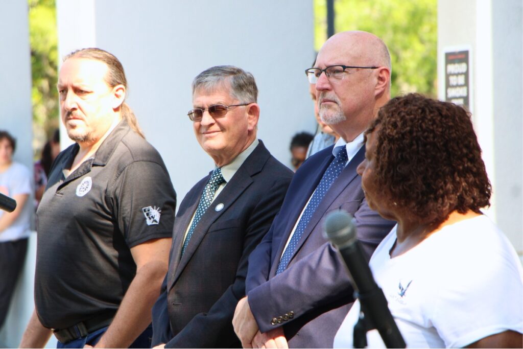 Gainesville Commissioners James Ingle (left), Edwin Book (center) and Mayor Harvey Ward attend Juneteenth flag raising. Photo by Lillian Hamman