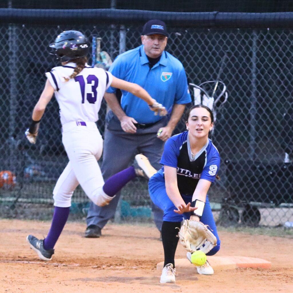 Gainesville's Josie Kirwan (13) beats the throw to first base on a fifth-inning hit against Belleview in the 5A Region 2 Quarterfinals. Photo by C.J. Gish
