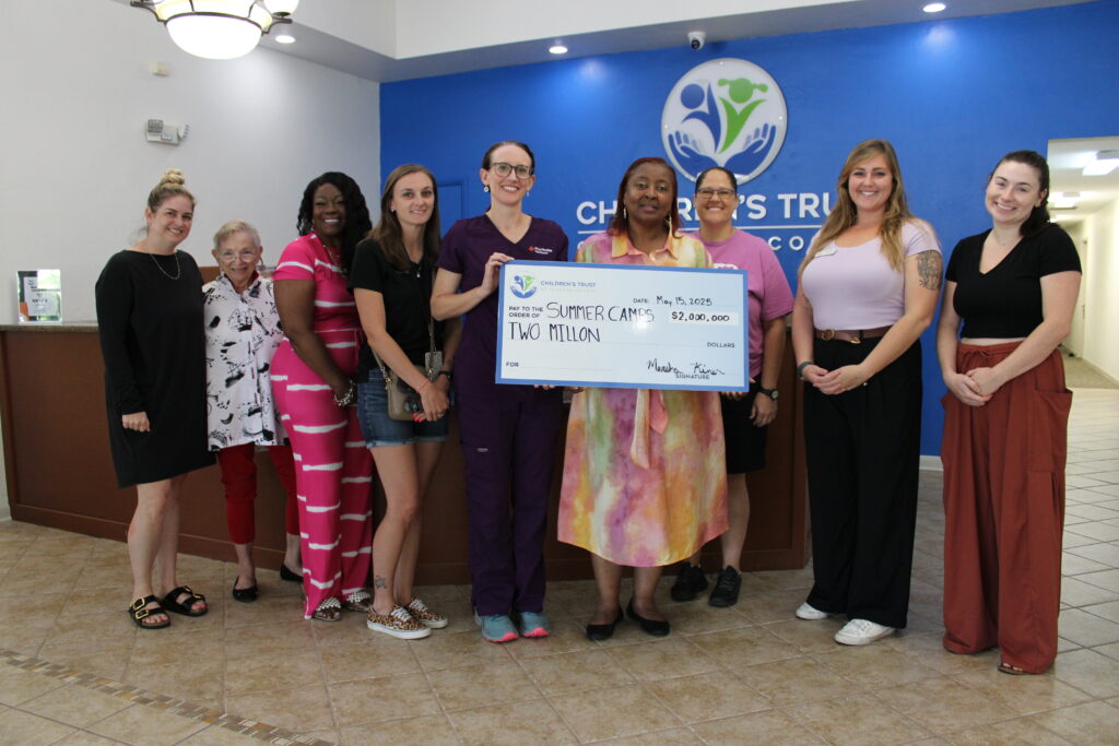 CTAC supporters present the organization with $2 million check for camps. Pictured here are representatives from Dance Alive, Just for Us Education, Community Impact Corporation, Limitless Adventures, Girls Place, Kids Count in Alachua County, Deeper Purpose Kids Academy and Gainesville Circus Center. Courtesy of CTAC