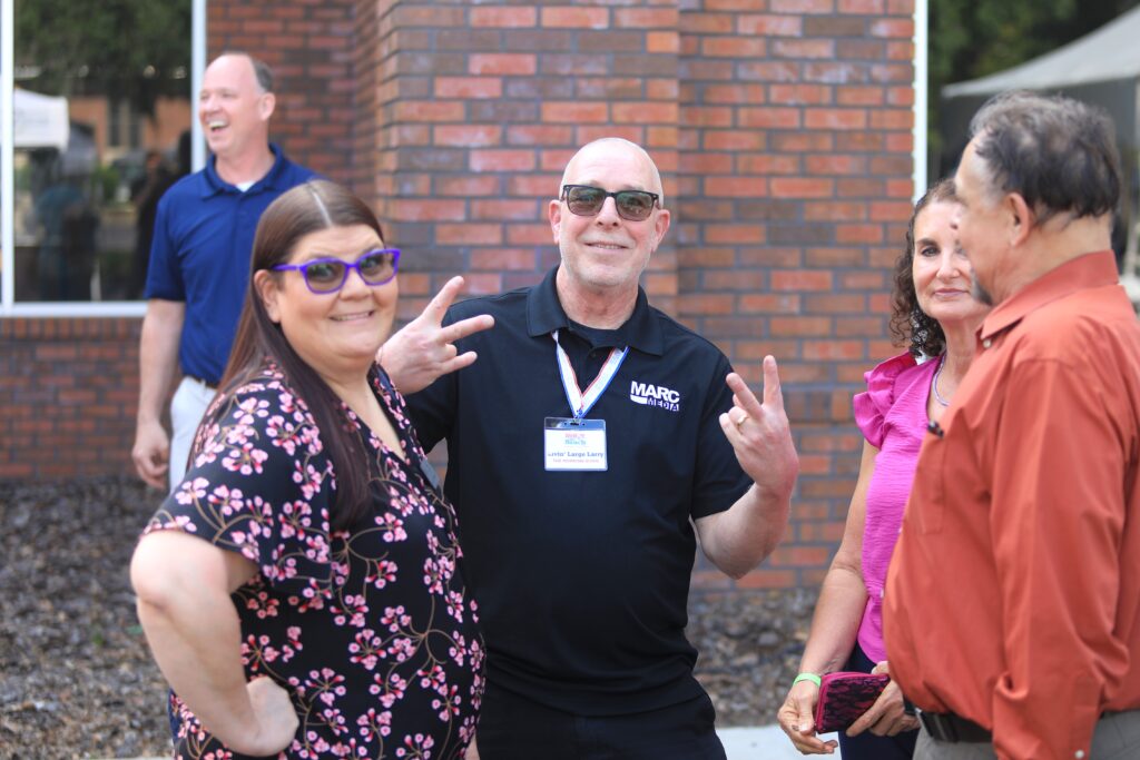 Larry Wilson drops a couple of V-signs for the camera. Photo by Seth Johnson