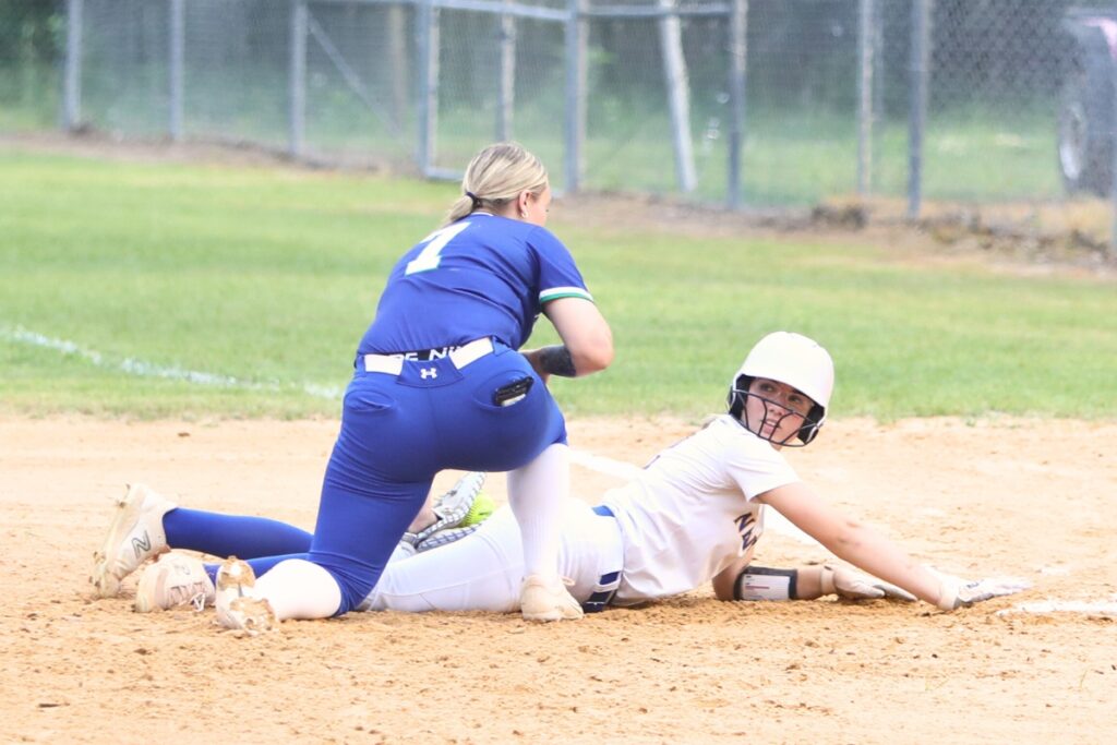 Newberry's Tristan Layfield dives safely back to first base in the first inning gainst Cornerstone Charter Academy (Belle Isle) in the 2A Region 2 Quarterfinals. Photo by C.J. Gish
