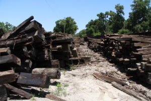 Piles of Track Line's stockpiled railroad ties in Newberry. Photo by Lillian Hamman