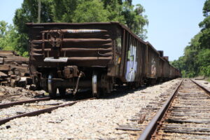 Railroad cars ship in stock piles of railroad ties for Track Line in Newberry. Photo by Lillian Hamman