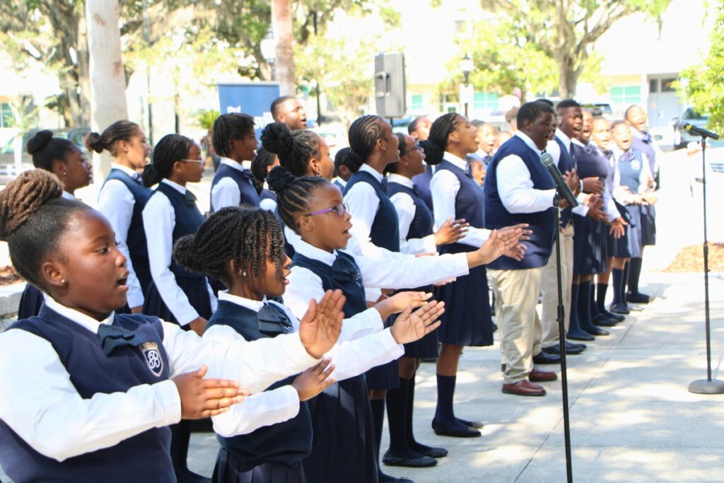 Saint Barbara Leadership Institute students perform at Juneteenth flag raising. Photo by Lillian Hamman