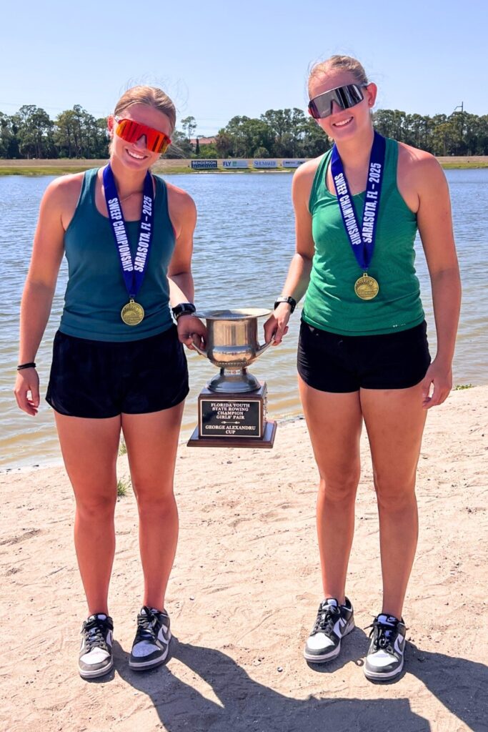 Sophie Goldsteing and Addy Mathews pose with their trophy for first place in their girls pair boat.
