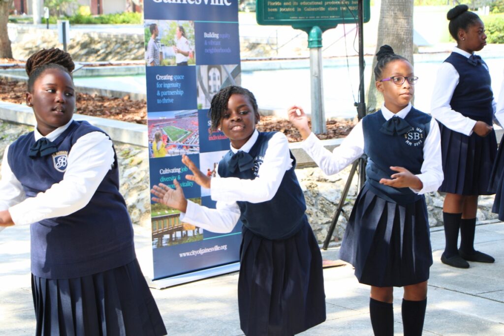 Students from the Saint Barbara Leadership Institute choir perform Lift Every Voice and Sing. Photo by Lillian Hamman