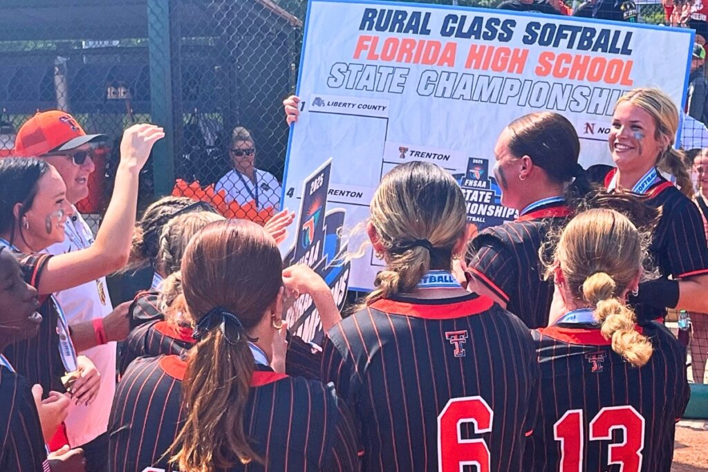 Trenton celebrates after capturing its second straight Rural softball state championship. Photo by Mike Ridaught