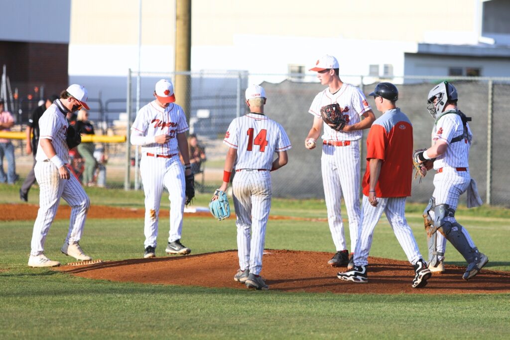 Trenton coach Chris Marlo goes to the mound to talk to pitcher Mason VunCannon against Chiefland in game two of the Rural Region 4 Semifinals. Photo by C.J. Gish