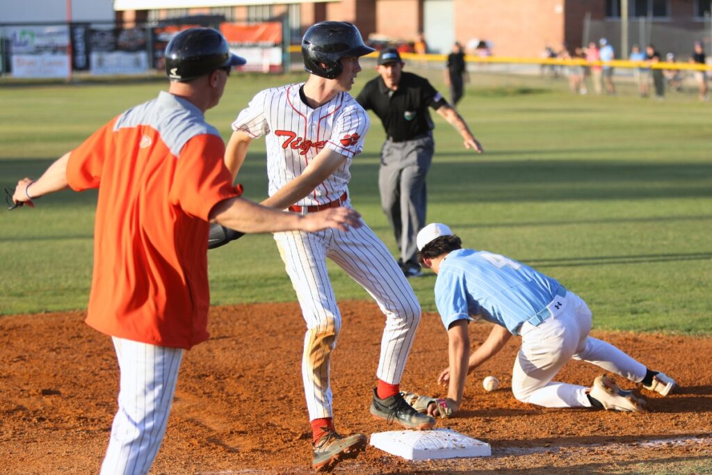 Trenton's Mason VunCannon beats a first-inning throw to third base against Chiefland in game two of the Rural Region 4 Semifinals. Photo by C.J. Gish