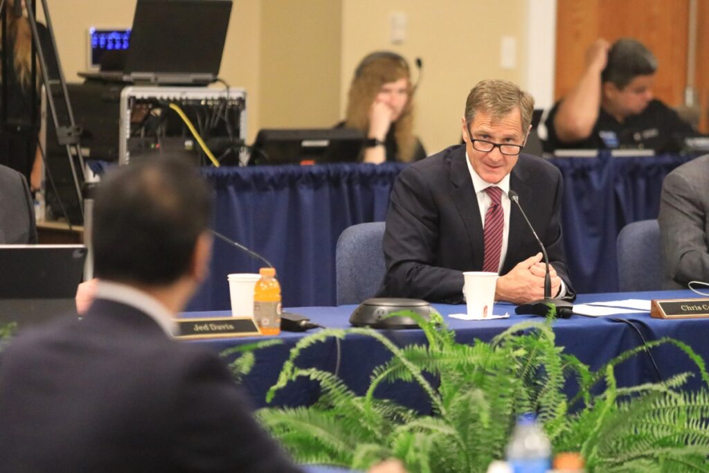 Trustee Chris Corr asks a question to Dr. Santa Ono.