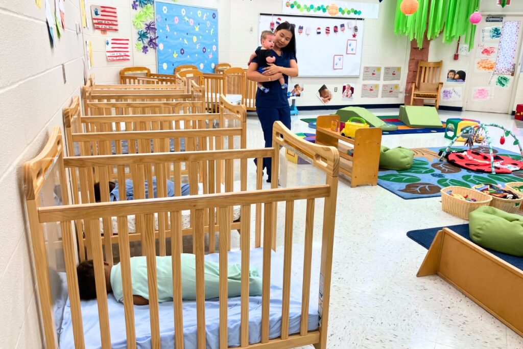 A GEZFLC teacher cares for infant students. Photo by Lillian Hamman
