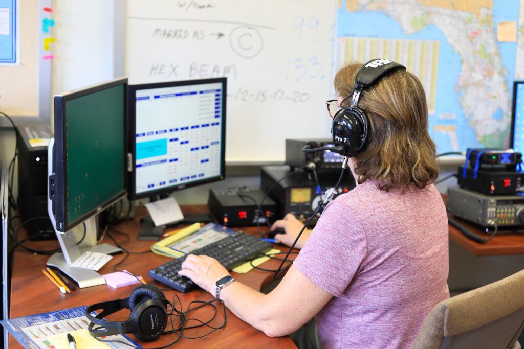 Barbara Matthews works to make contact with other amateur radio groups during the 2025 summer field day. Photo by Seth Johnson