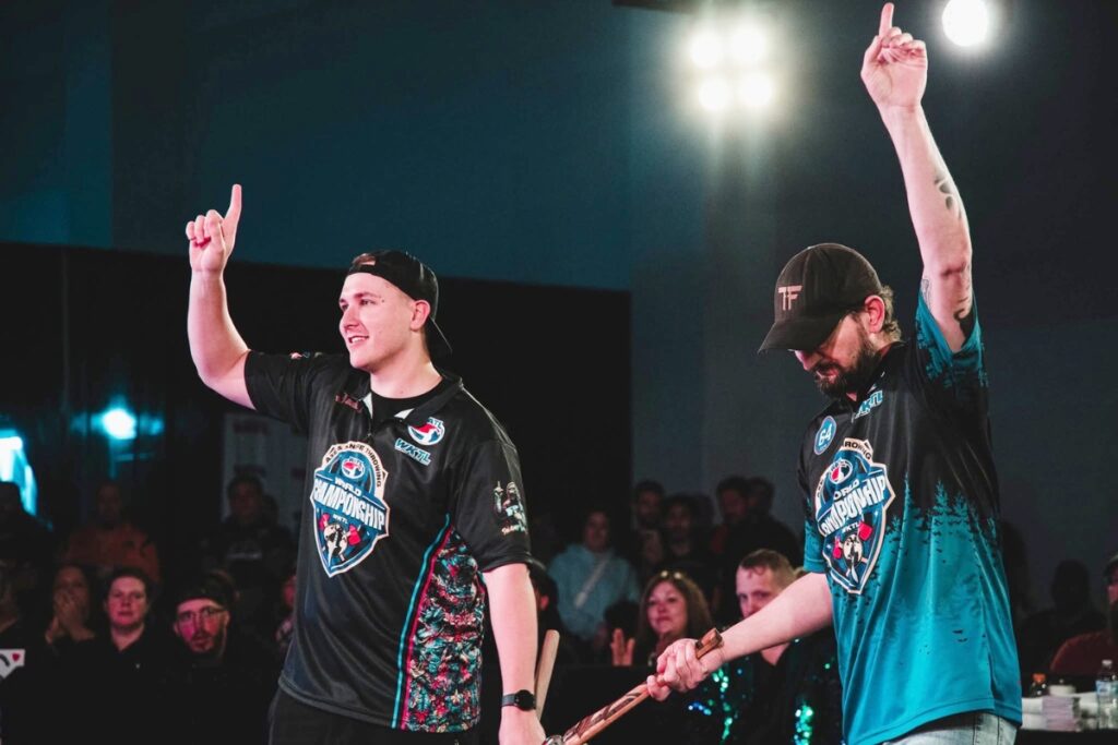 Co-owner of Swamp Axe, Dylan Teets (left), competed in the World Axe Throwing Championship. Courtesy of World Axe Throwing Championship