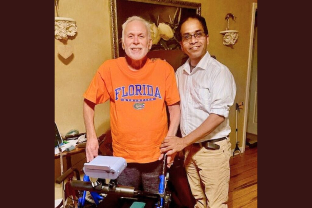 Dr. Abhishek Kumar (right) with one of his patients using the Fallgard™ device on his walker. Courtesy of Fallgard (1)