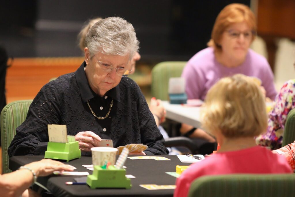 Mary Ann McIntyre partnered with Beth Paul for the first round of the bridge tournament at Oak Hammock. Photo by Seth Johnson