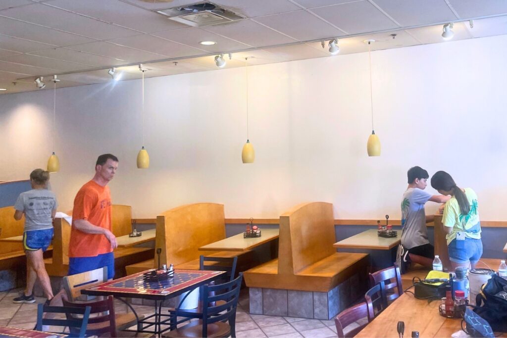 Members of Gainesville Area Rowing paint The Bagel Bakery. Courtesy of Jason Cole