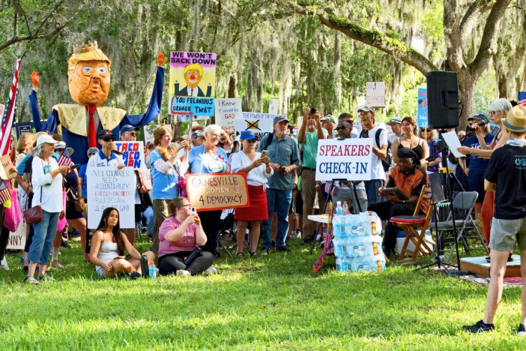 Protesters gathered in Cora Roberson Park in Gainesville for the No Kings Day rally on Saturday.