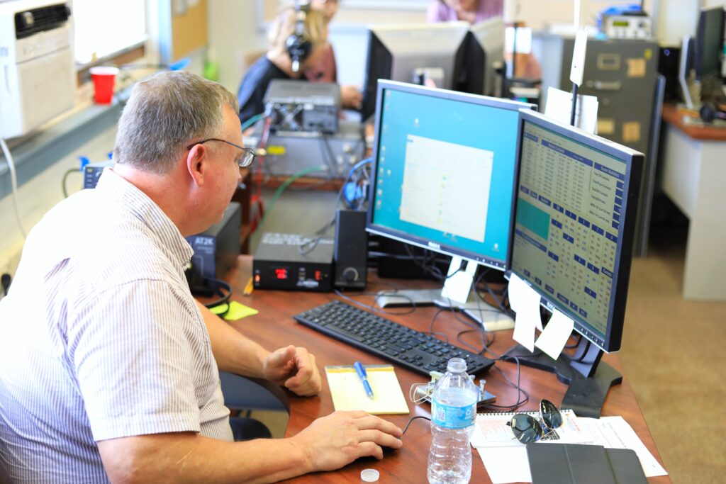 Terry Gorden works on software to log contacts during the summer field day. Photo by Seth Johnson