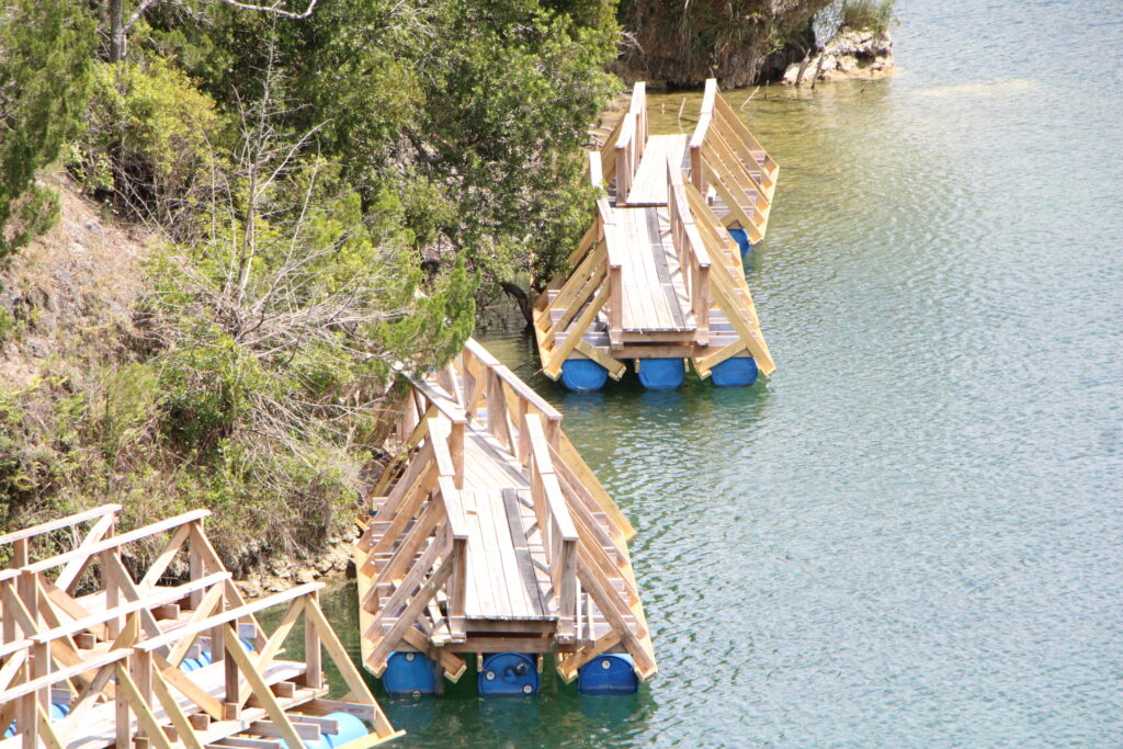 Zip line landing docks float in Haile Quarry. Photo by Lillian Hamman