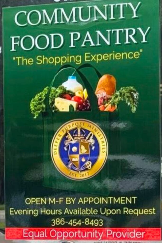 A sign for Deeper Purpose's food bank. Courtesy of DPCC