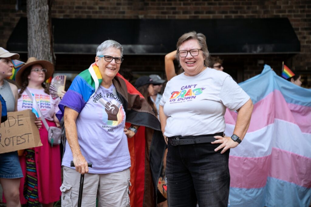 Alachua County Commissioner Mary Alford (right) was one of the people who attended a rally to protest the removal of rainbow crosswalks in downtown Gainesville on Friday. Photo by Tim Rodriquez