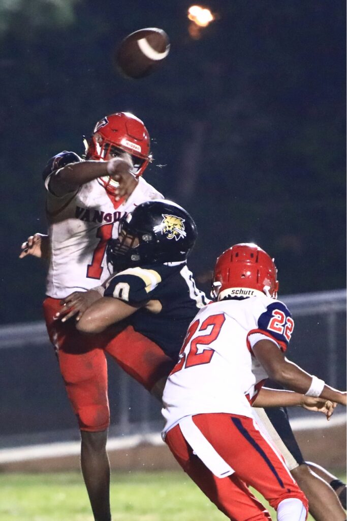 Buchholz's Amir Sheppard (0) pressure's the Vanguard (Ocala) quarterback. Photo by C.J. Gish