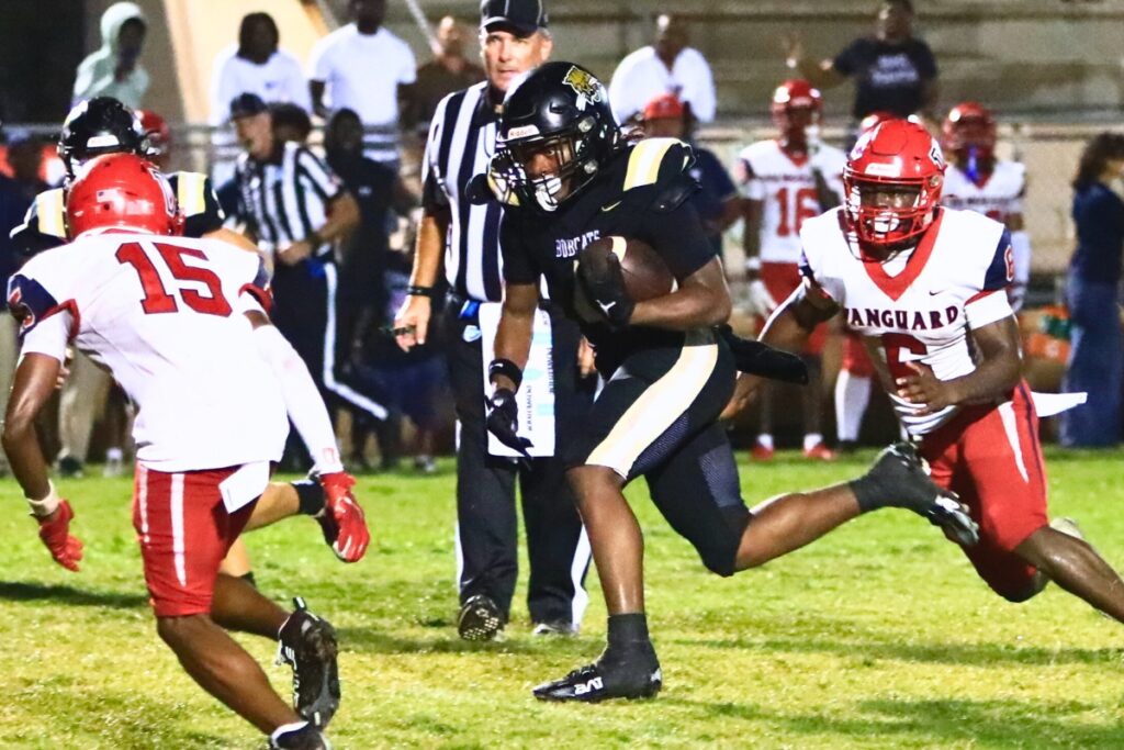 Buchholz's Josh Menefee (4) with a second-quarter run against Vanguard (Ocala). Photo by C.J. Gish