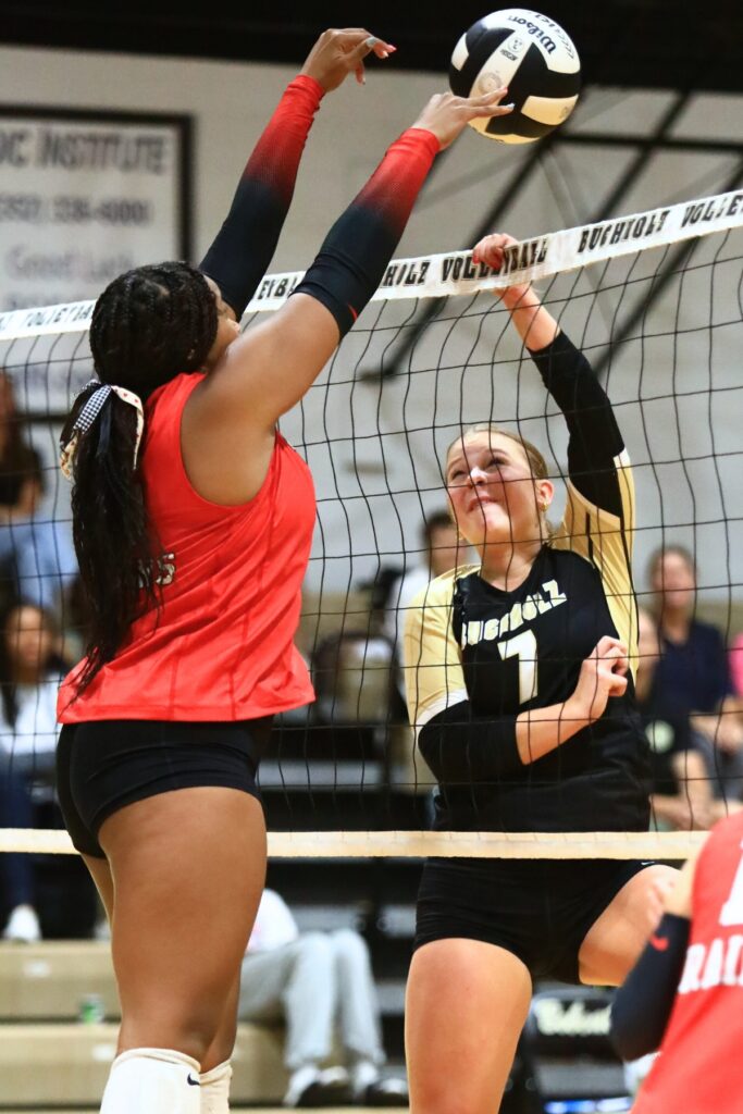 Buchholz's Julia Almond (7) in the net against Santa Fe's Ajah Graddy (15). Photo by C.J. Gish