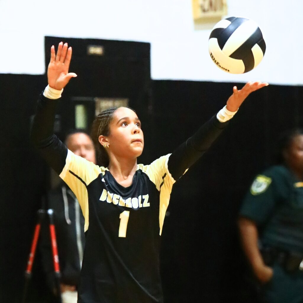 Buchholz's Kiana Wilburn (1) with a serve against Santa Fe. Photo by C.J. Gish
