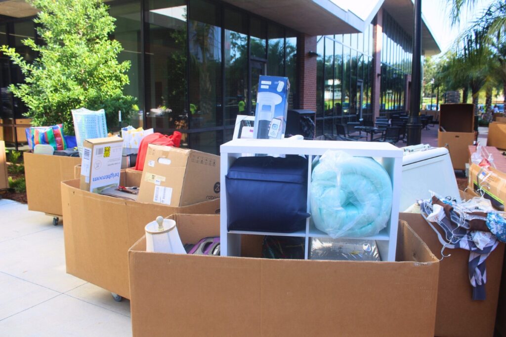 Carts filled with move-in essentials were stacked up outside building three of the Honors Village Saturday morning. Photo by Nick Anshultz