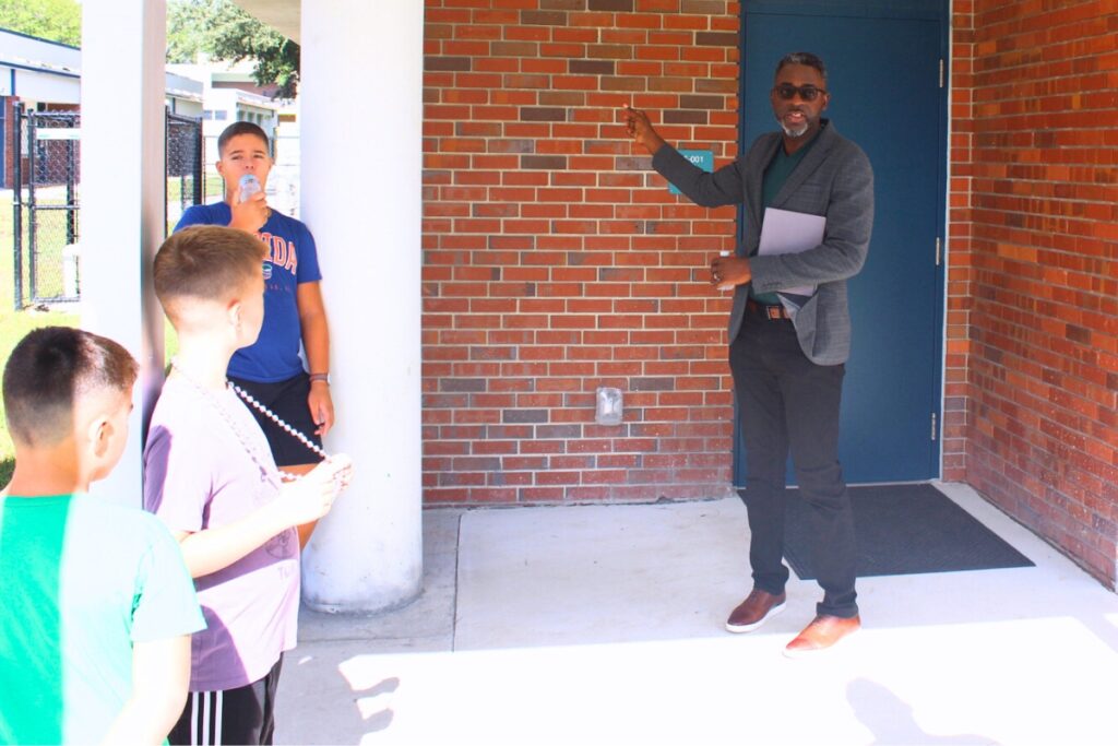 Chad Jones, a principal with PBK Architects, gives families a tour of the revitalized Littlewood Elementary School campus. Photo by Nick Anshultz