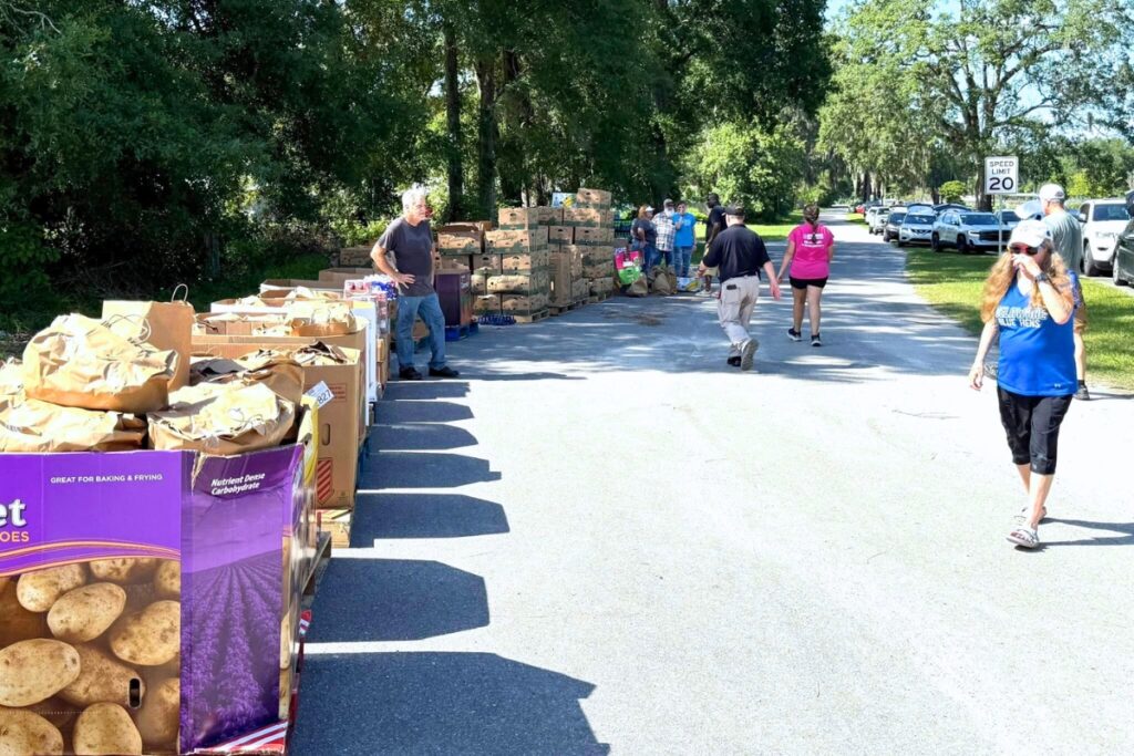 Citizens help distribute food from Deeper Purpose Community Church's food bank. Courtesy of DPCC