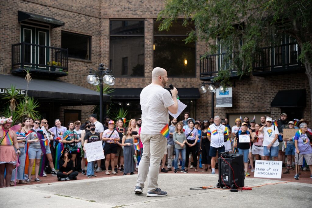 City Commissioner Casey Willis speaks at Friday's protest over the removal of rainbow crosswalks in downtown Gainesville. Photo by Tim Rodriquez