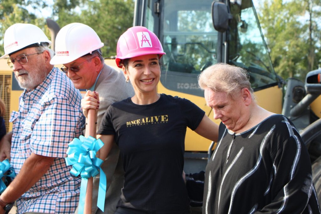 Dance Alive principal dancer Carla Amancio (second from right) breaks ground with ballet founder Kim Tuttle (right). Photo by Lillian Hamman