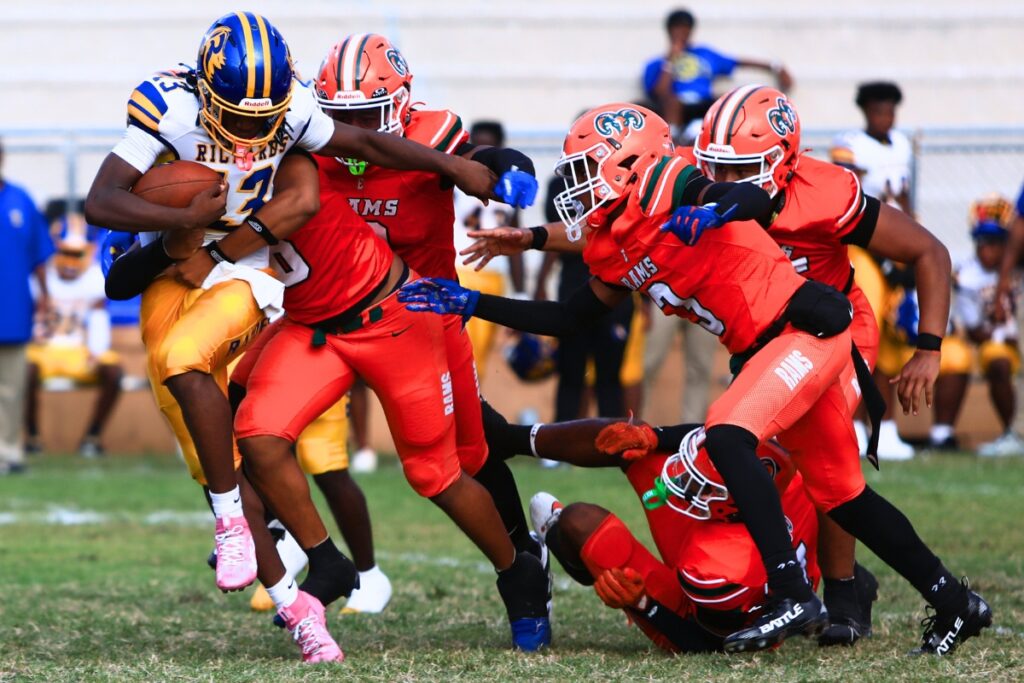 Eastside defenders stuff a run against Rickards (Tallahassee). Photo by C.J. Gish