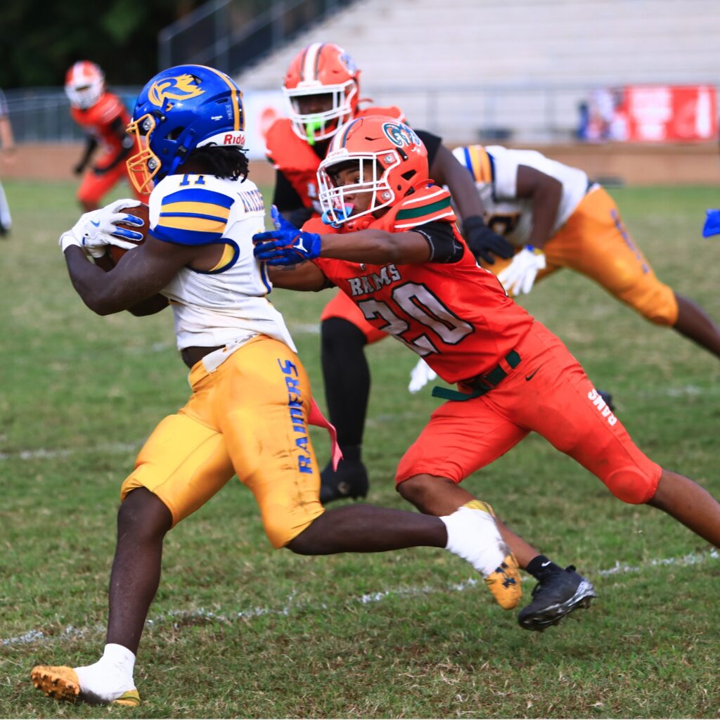 Eastside's Brandon Goode (20) goes in for a tackle against against Rickards (Tallahassee). Photo by C.J. Gish